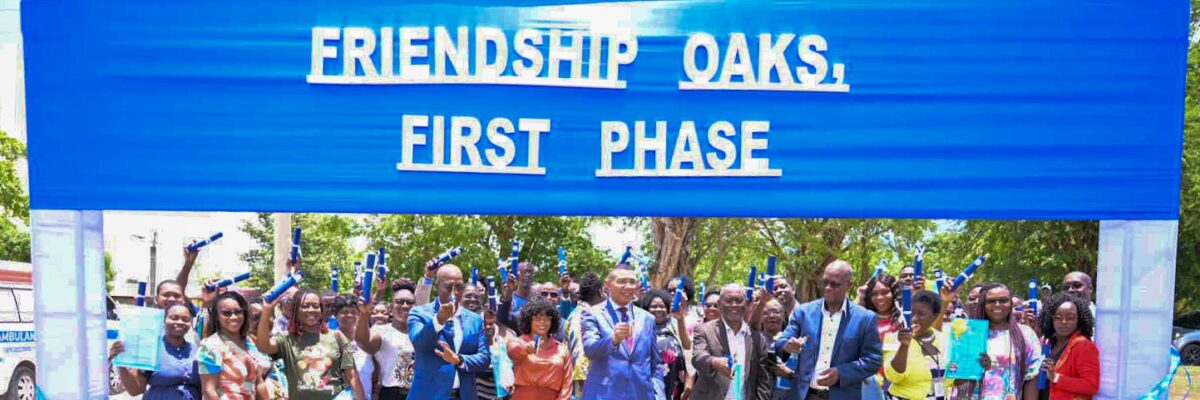 PM Holness hands over land titles to NHT applicants for lots at Friendship Oaks