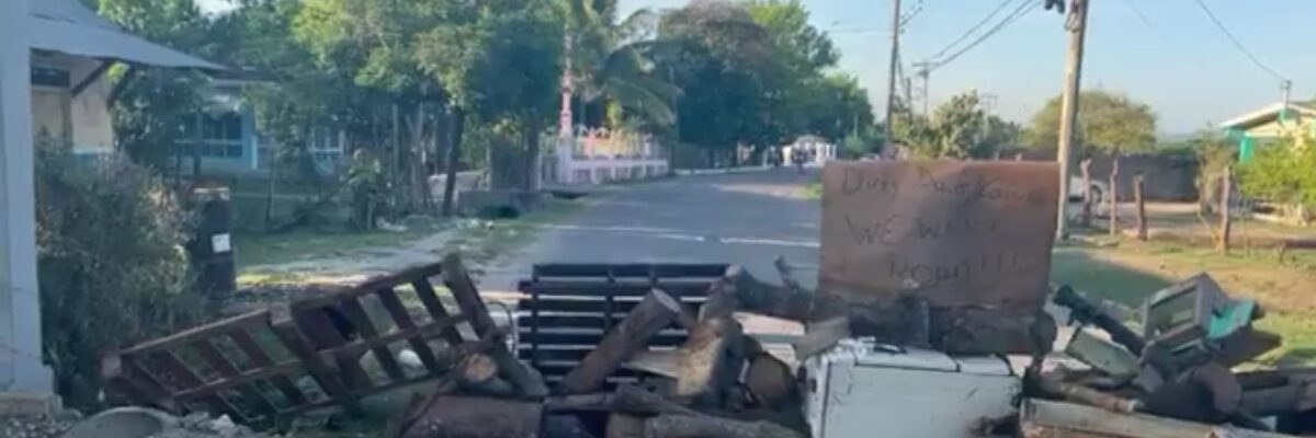 Residents blocked sections of Comfort main road in York Town, Clarendon this morning as they protested poor road conditions