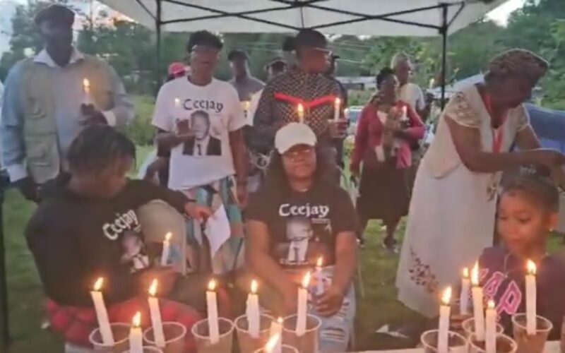 Call for unity against crime made at candle light vigil for slain P M youth awardee