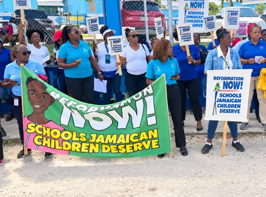 JTA stages protests at 4 schools over slow recovery  in Education Sector after Hurricane Melissa