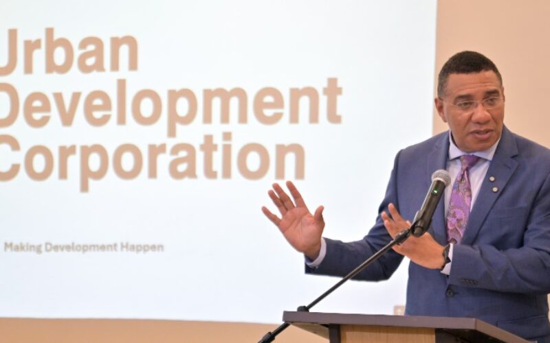 PM Holness urges UDC to use its lands for housing development