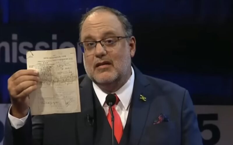 PNP President Golding showcases birth certificate in last night’s debate to dispel uncertainties about his nationality