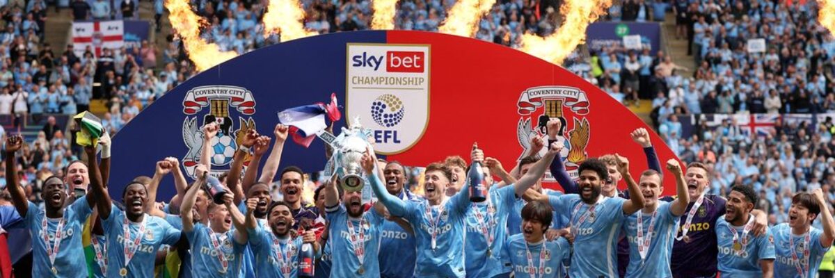 Coventry with Jamaica’s Reggae Boyz: Ephron Mason-Clark and Joel Latibeaudiere celebrate championship title