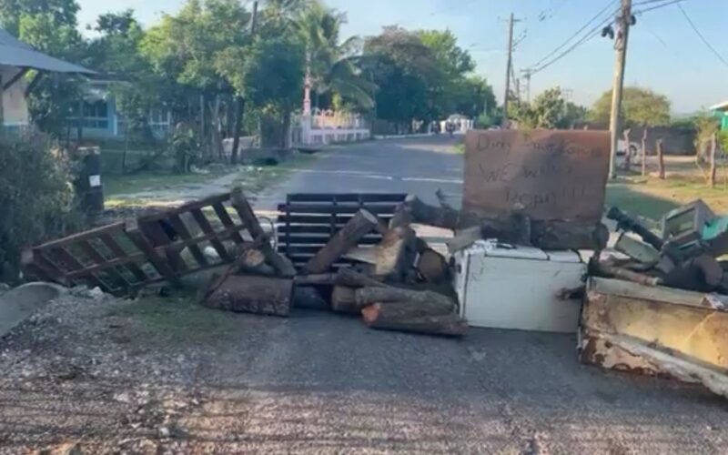 Residents blocked sections of Comfort main road in York Town, Clarendon this morning as they protested poor road conditions