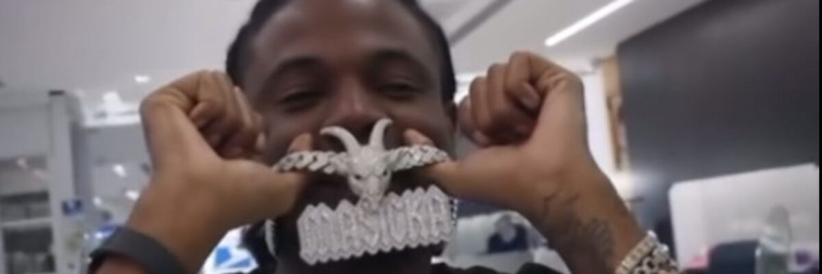 Masicka shows off G.O.A.T. pendant as debate heats up