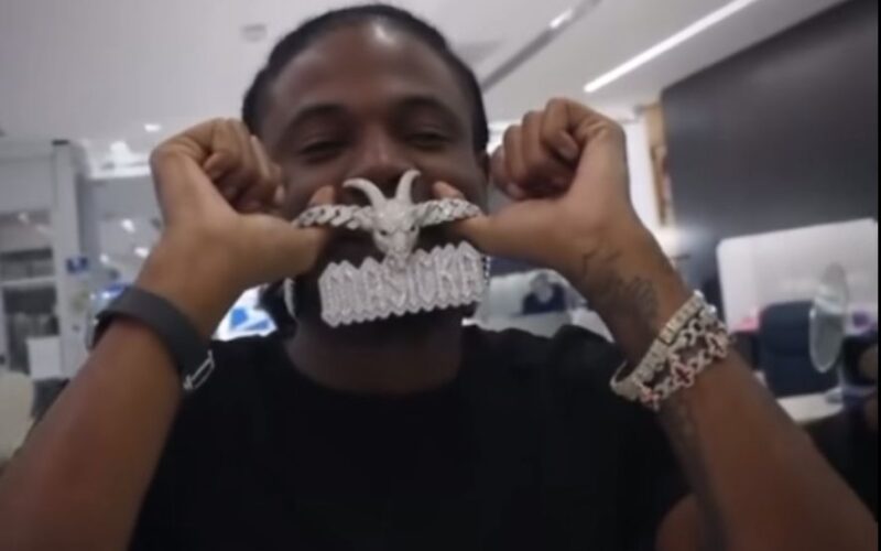 Masicka shows off G.O.A.T. pendant as debate heats up