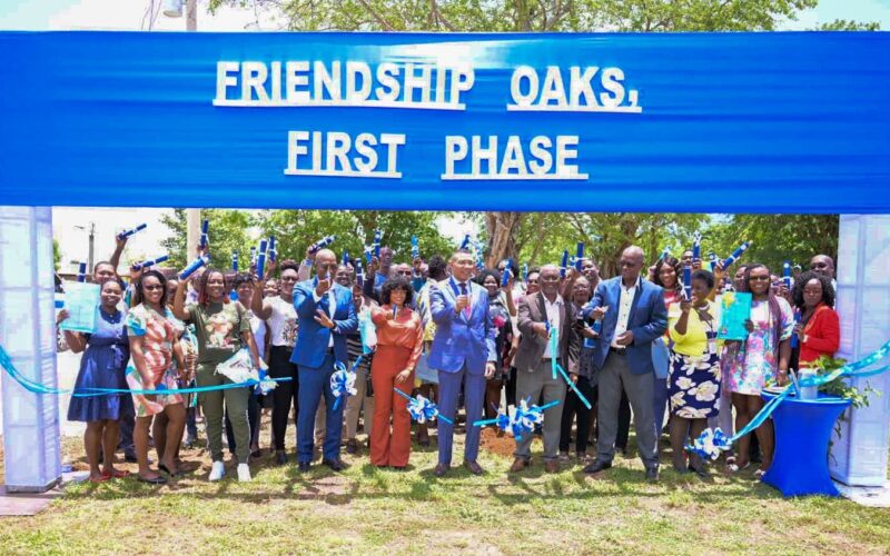 PM Holness hands over land titles to NHT applicants for lots at Friendship Oaks