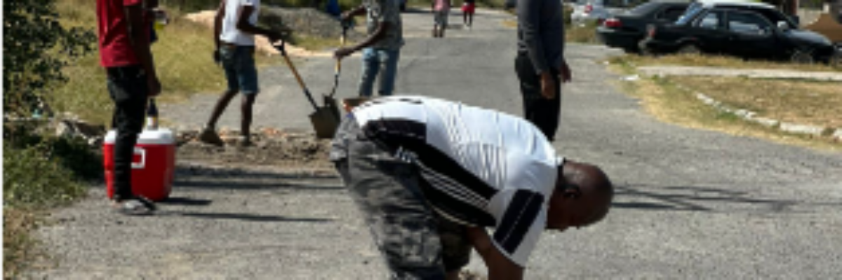 Greater Portmore residents patch potholes for National Labour Day