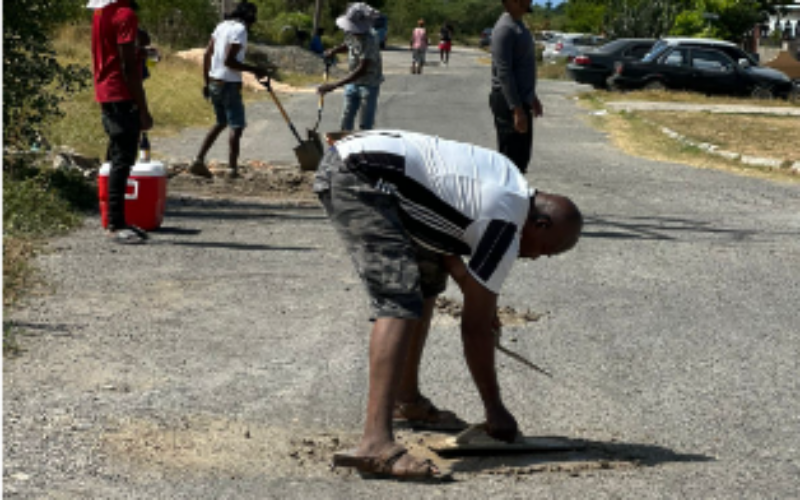 Greater Portmore residents patch potholes for National Labour Day