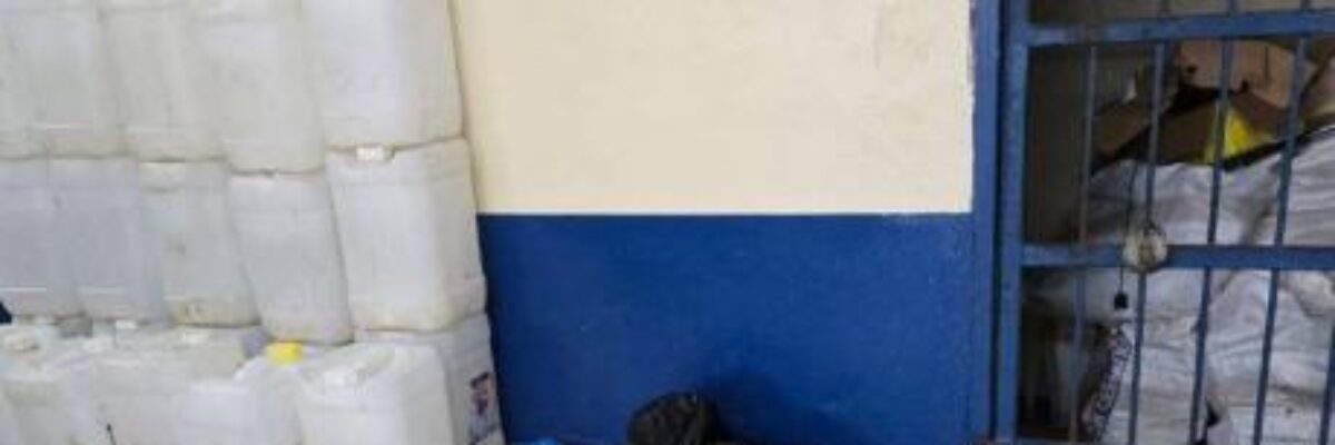 Three people in custody, several containers of bulk rum seized following raid in Siloah Housing Scheme yesterday