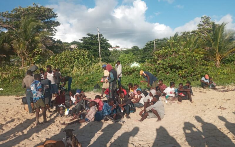 Another set of Haitians arrive at a beach in Portland