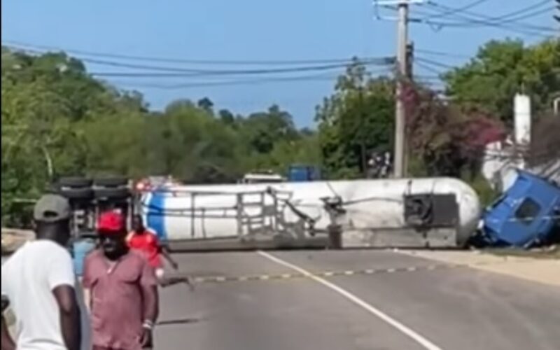 Crane to be used to remove gas tanker that overturned along roadway in Trelawny  